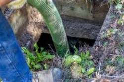 Hose inserted into a blocked drain